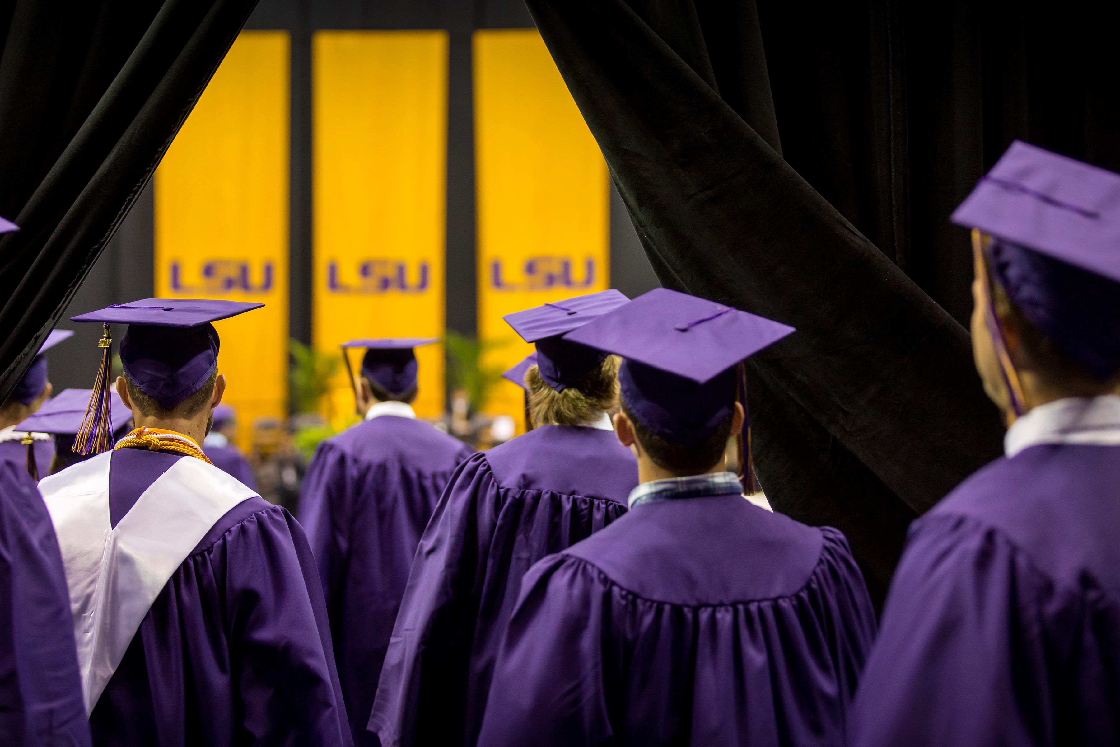 graduates at commencement