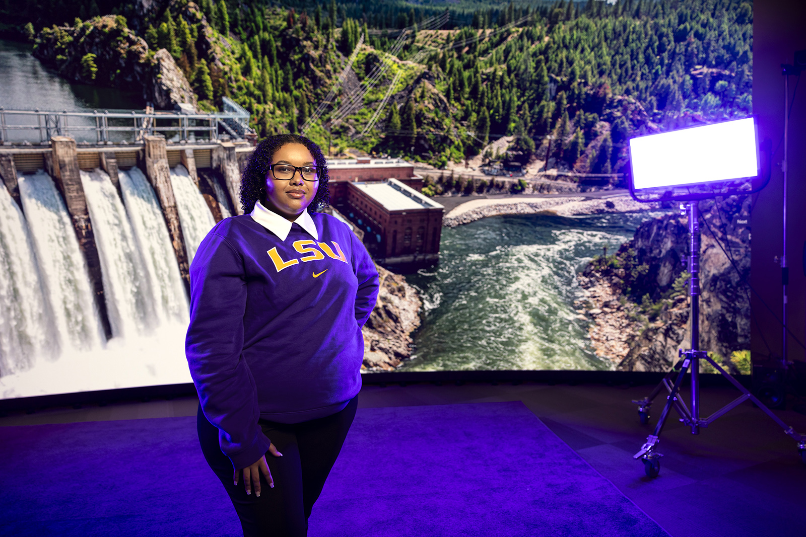 Delina Tewelde portrait with hydro-electric backdrop