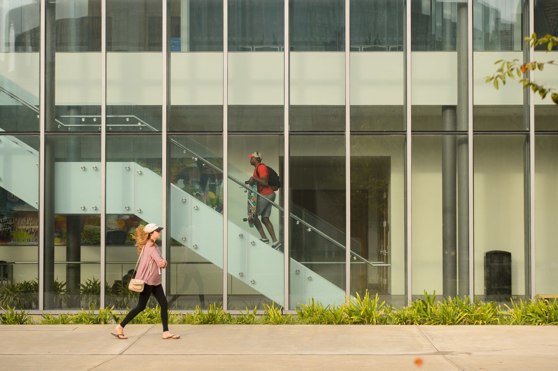 Students walking downstairs and in courtyard of the BEC