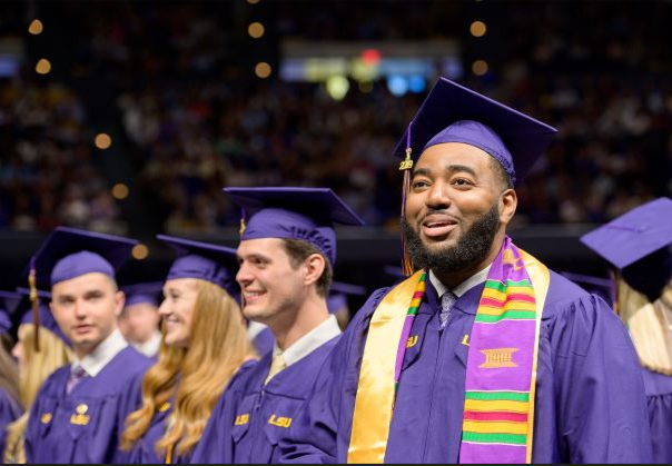 students in caps and gowns at graduation