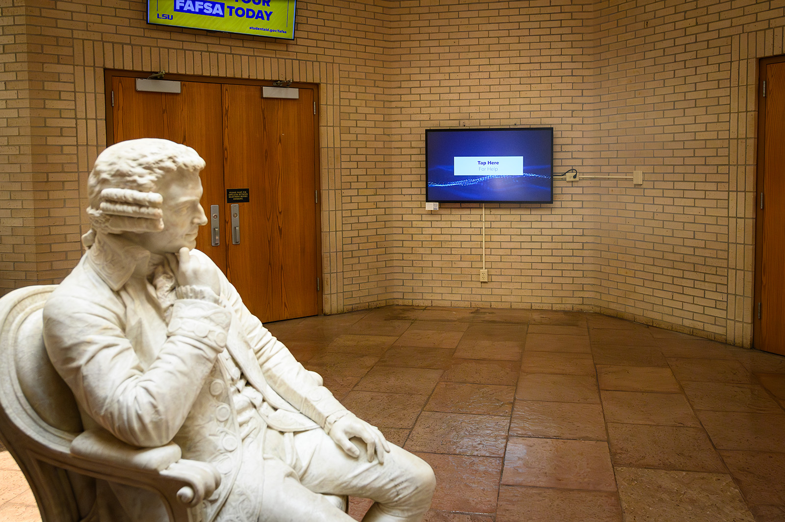 signage installation in school of music lobby