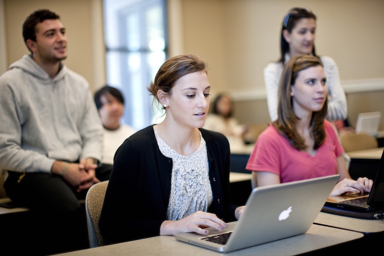 photo: student working on laptop