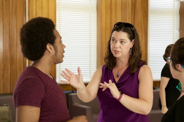 faculty member talking to student