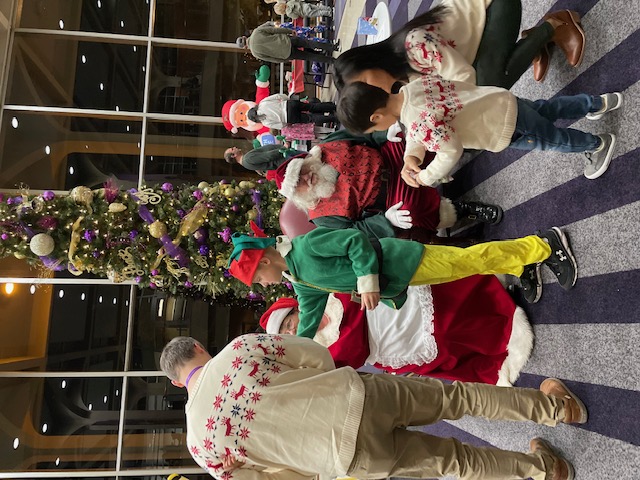 Santa Claus and Mrs. Claus with children